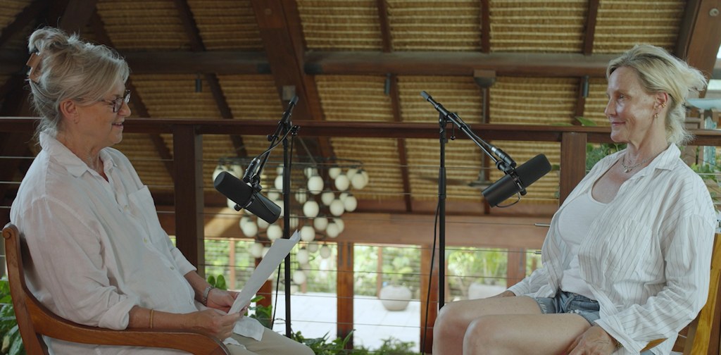 Erin on podcast facing kate griggs, both in white shirts
