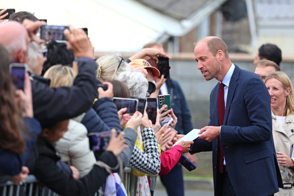 Prince William greets well-wishers while departing from a visit to Swiss Valley Community Primary School