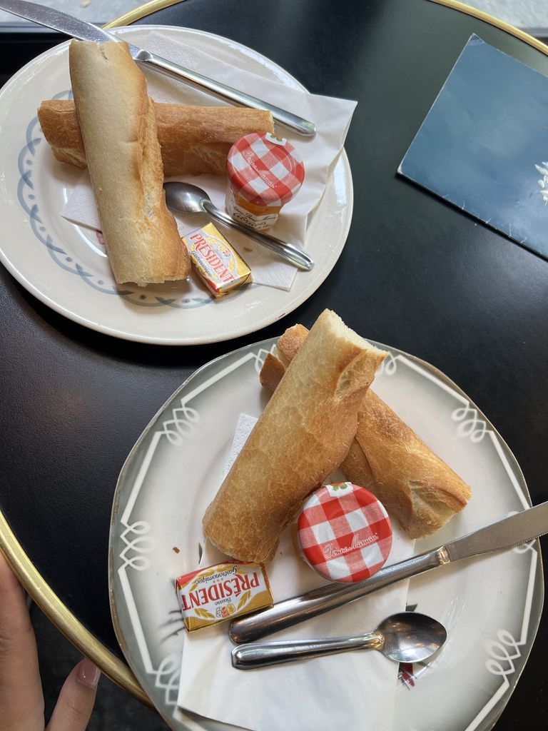 two baguettes and jam in a paris cafe