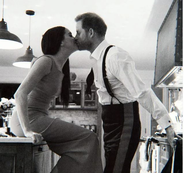 Meghan and Harry kiss inside Frogmore Cottage kitchen