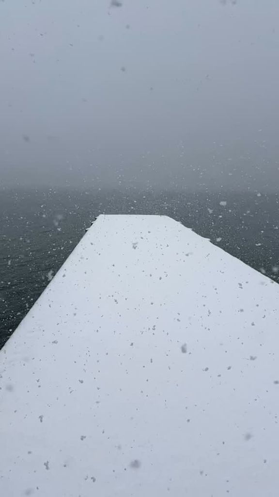 David Muir captures the snowfall on the pier near his lakeside upstate New York home, shared on Instagram Stories