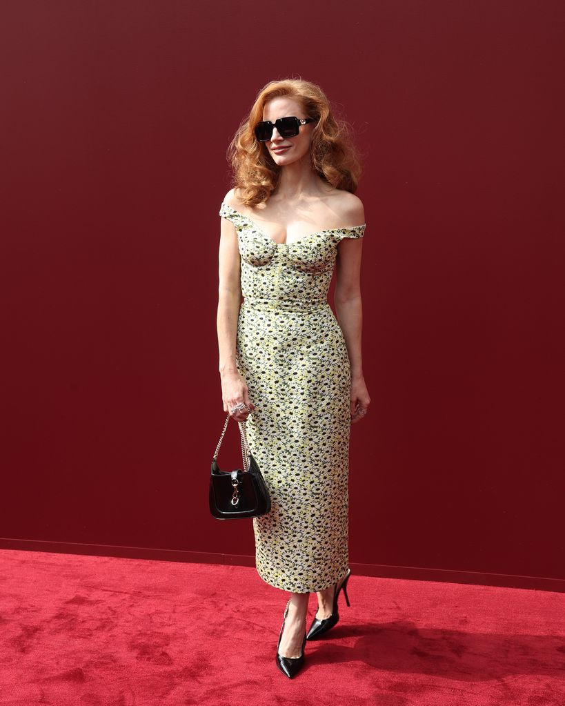 Jessica Chastain on red carpet in sunflower fitted dress