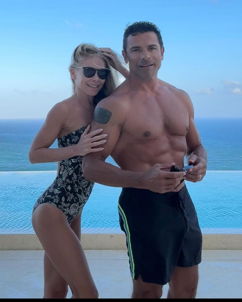 Kelly Ripa and Mark Consuelos shows off their fit physiques in swimwear