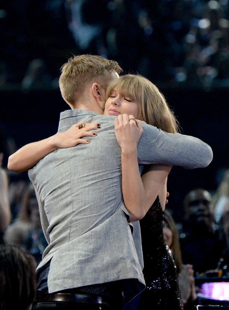 Calvin Harris hugging taylor swift