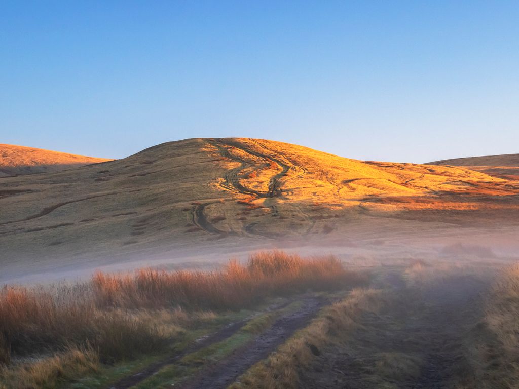 Mist at sunrise, on Pendle Hill, Ribble Valley, Lancashire, UK.