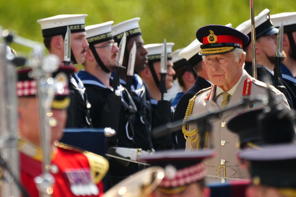 King Charles III looks on as he attends the Service of Remembrance to commemorate the 80th Anniversary of VJ Day at The National Memorial Arboretum