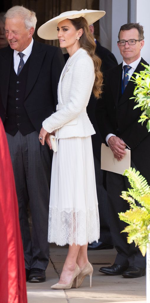 Catherine, Princess of Wales side on in white dress and hat