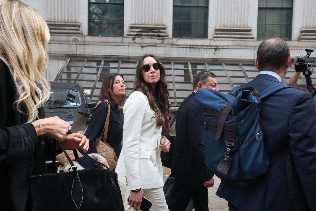 Charlie Javice (C), former fintech entrepreneur, leaves after her sentencing hearing at federal court in Manhattan on September 29, 2025, in New York City. Javice founded Frank, a college financial aid assistance startup, and was convicted on several charges relating to fraud after artificially inflating her customer numbers while selling her company to JP Morgan Chase for $175 million. She was sentenced today to 7 years in prison