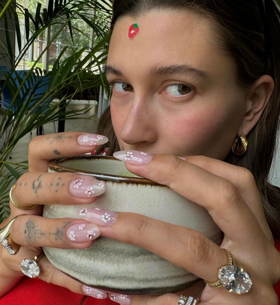 Hailey posed with a strawberry-shaped stickers on her forehead