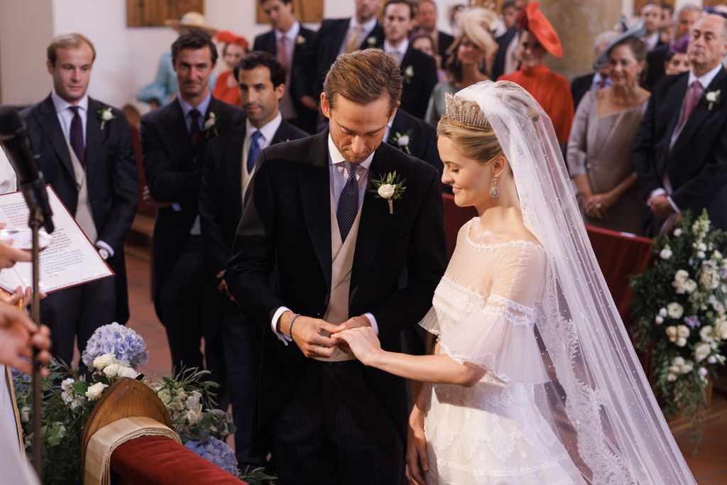 bride and groom exchanging rings