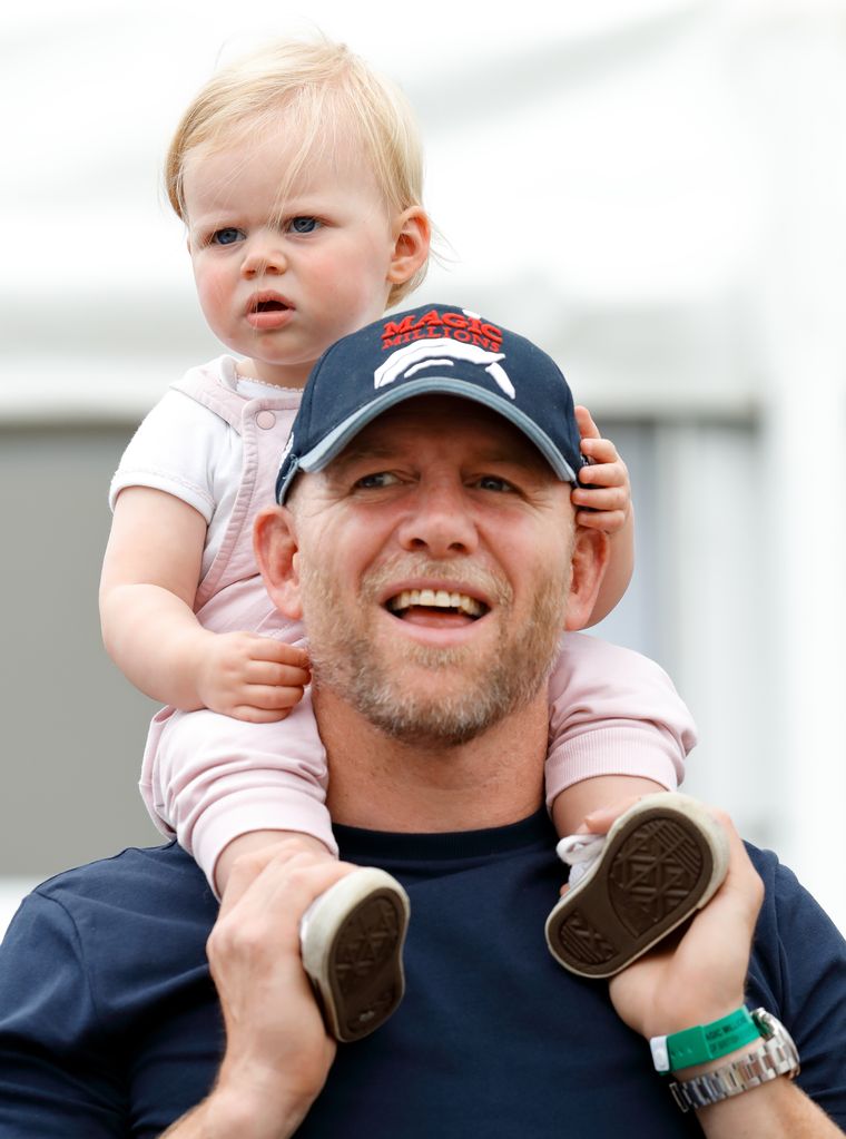 Mike Tindall carries daughter Lena Tindall