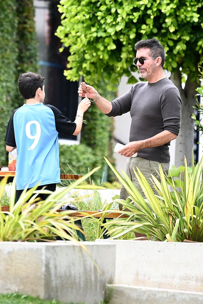 Simon Cowell passed his son Eric a chocolate ice cream