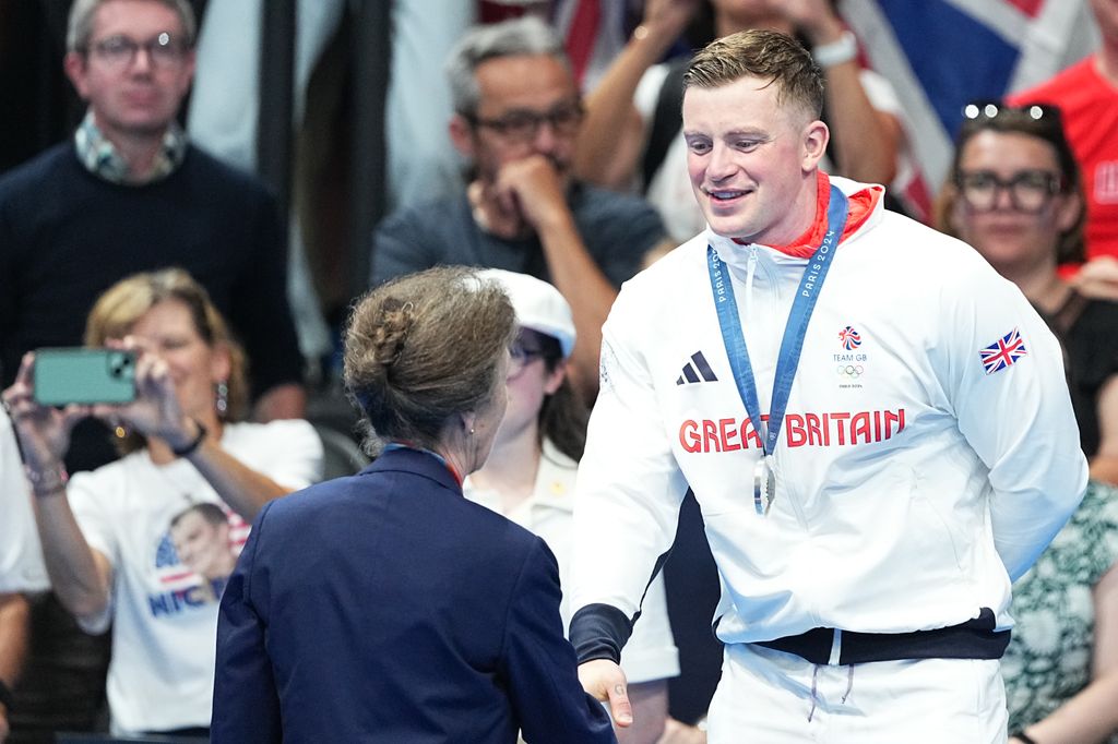 Princess Anne presents silver medal to Adam Peaty