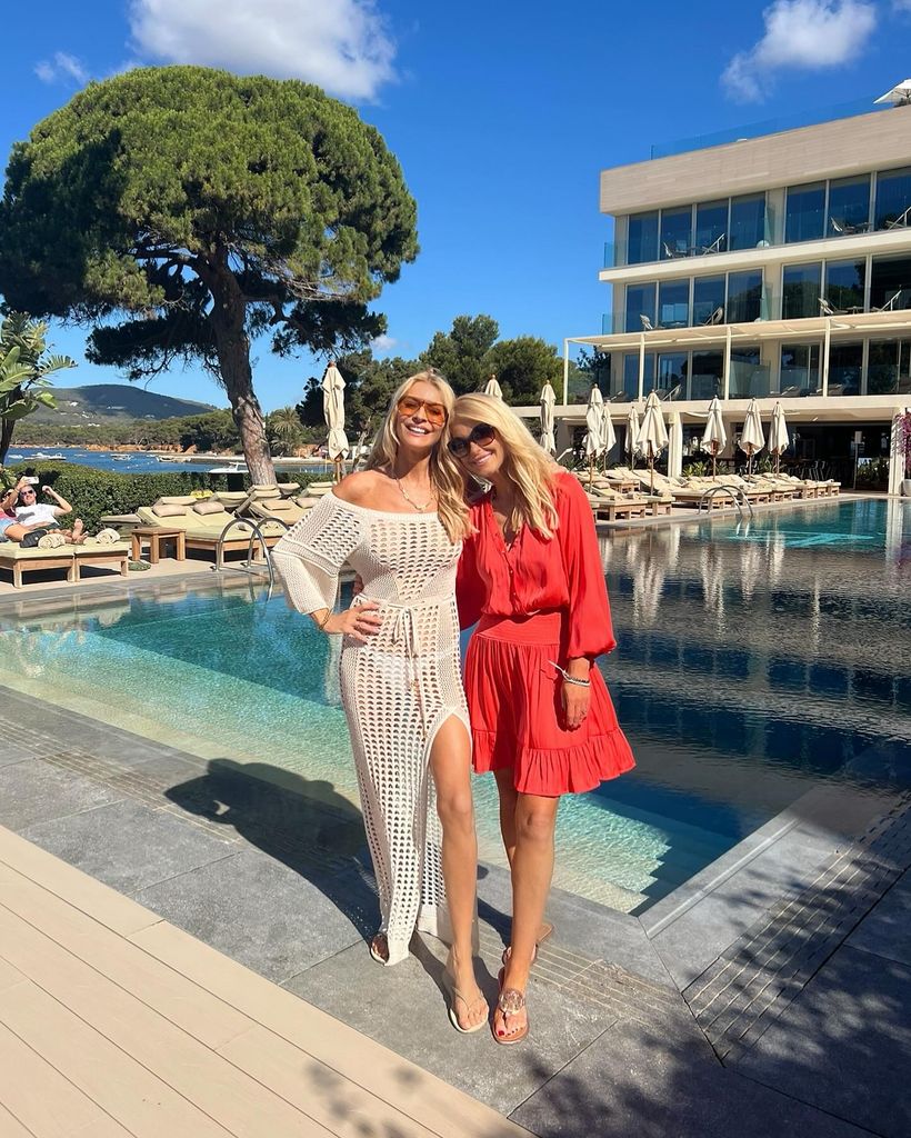 Tess Daly and Naia Beach co-founder Gayle Layton posing by pool in Ibiza