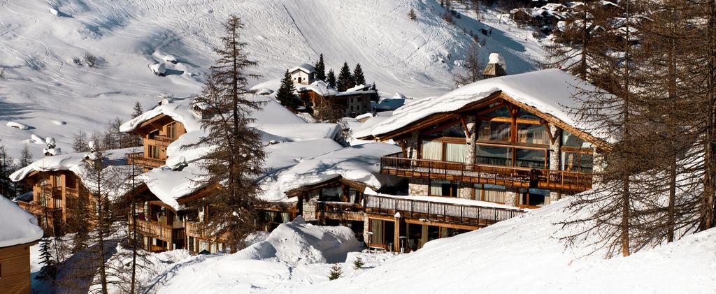snow covered  French timber clad ski chalet