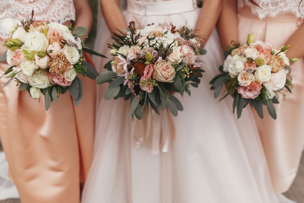 Bridesmaids holding wedding bouquets