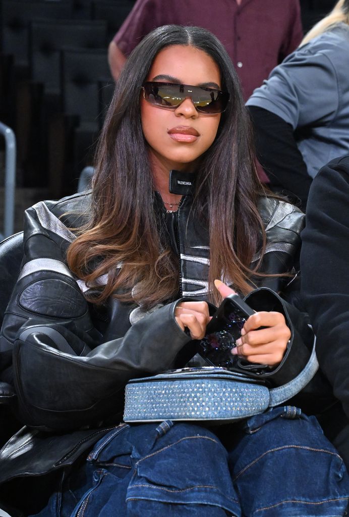 Blue Ivy in a biker jacket and jeans