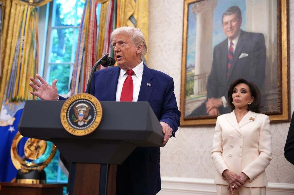  U.S. President Donald Trump speaks alongside interim U.S. Attorney for Washington, D.C. Jeanine Pirro during her swearing in ceremony 