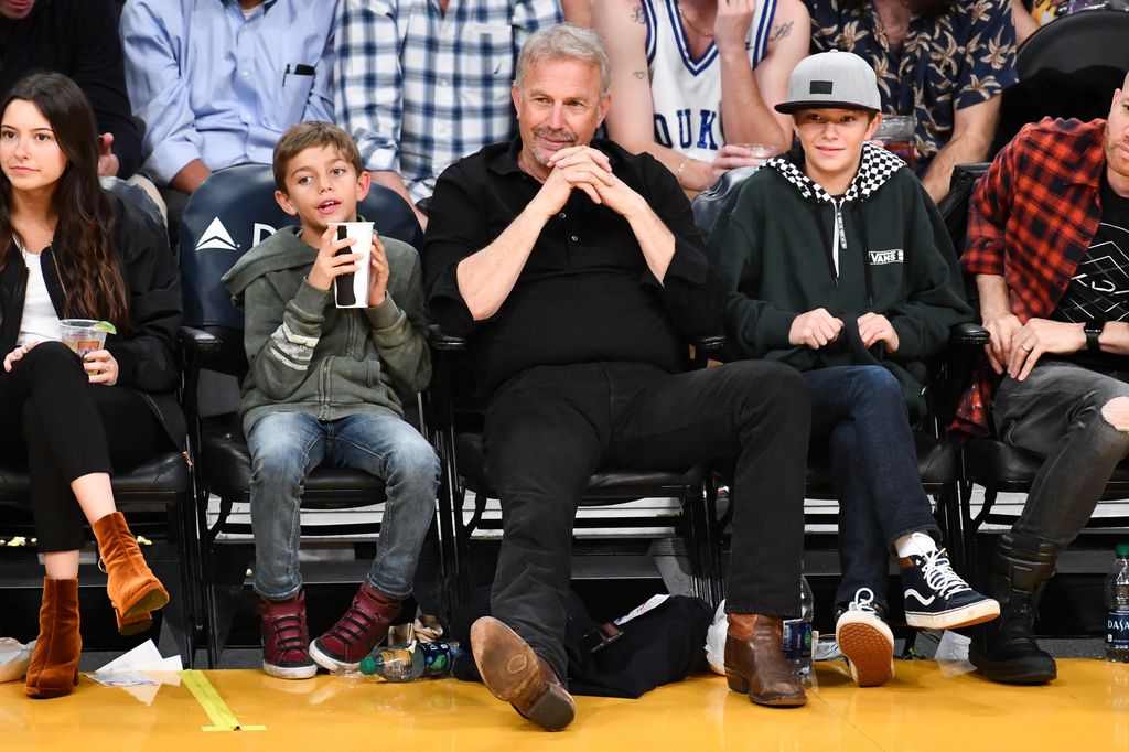 LOS ANGELES, CALIFORNIA - DECEMBER 10: Kevin Costner, Hayes Logan Costner and Cayden Wyatt Costner attend a basketball game between the Los Angeles Lakers and the Miami Heat at Staples Center on December 10, 2018 in Los Angeles, California. (Photo by Allen Berezovsky/Getty Images)