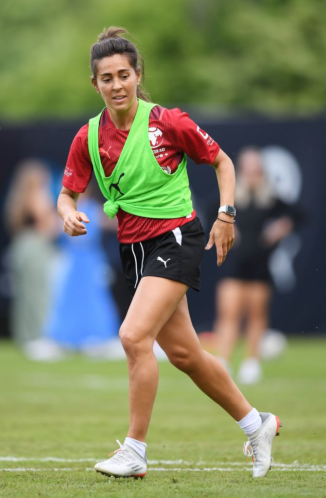 Fara Williams running in a hi vis vest