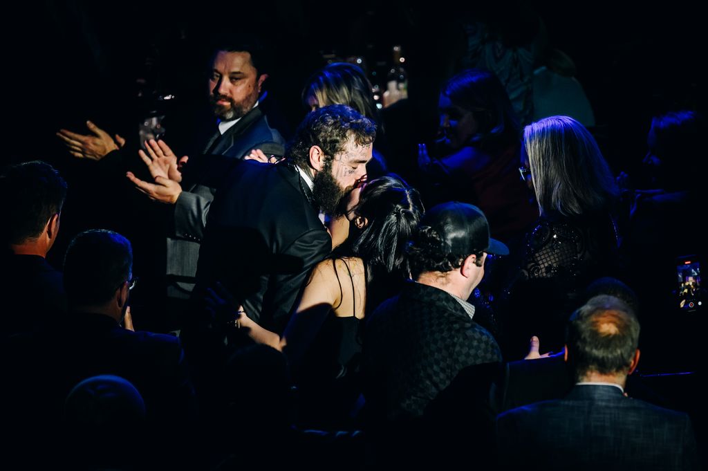 Post Malone kisses his fiance Jamie at the 2023 Songwriters Hall of Fame Induction Ceremony 