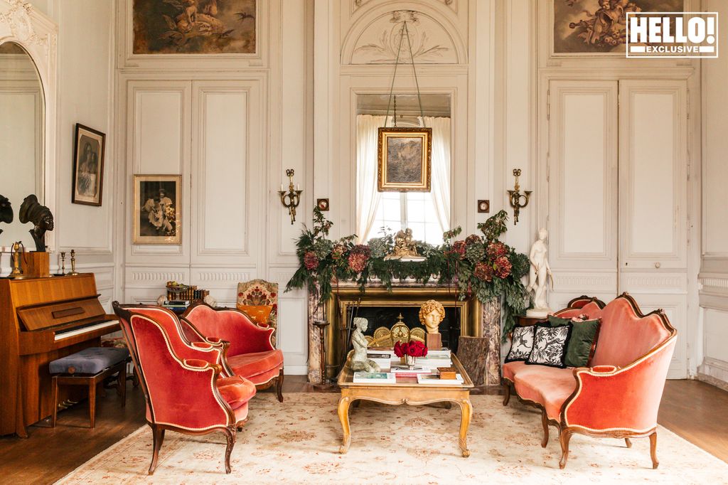 Catherine Roger's living room with red chairs at Chateau Marcellus near Bordeaux