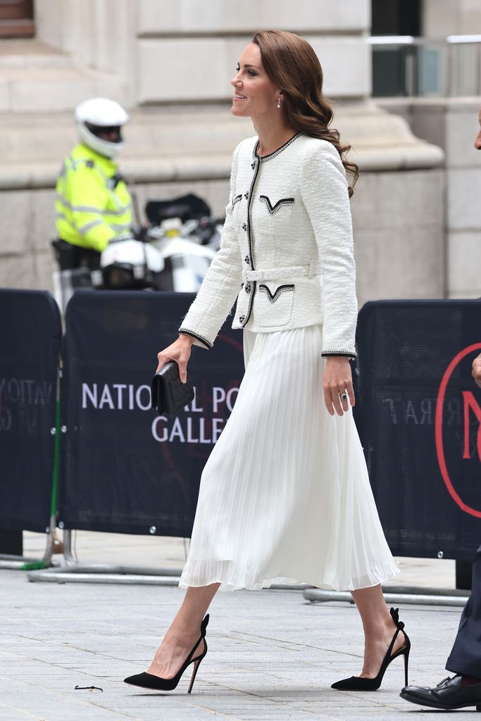 The Princess of Wales wearing a white dress by Self-Portrait, a Chanel quilted clutch and black Aquazzura pumps 
