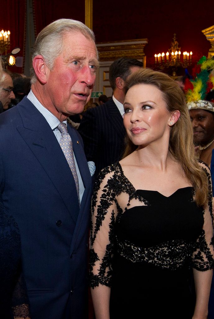 Kylie Minogue meets Prince Charles, Prince of Wales during a reception for prominent Papua New Guineans, Australians and New Zealanders living in the UK