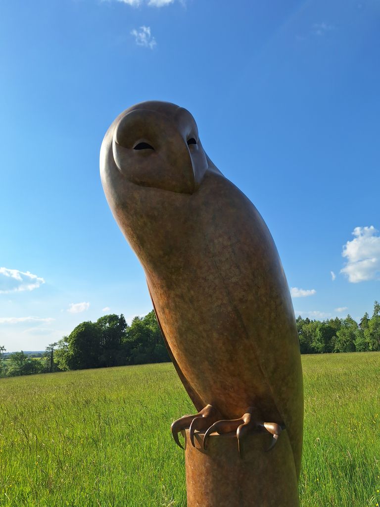 A sculpture in the shape of an elongated owl