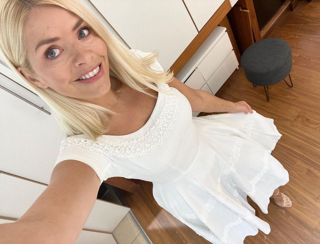 Holly Willoughby taking a selfie in a boho white dress on This Morning