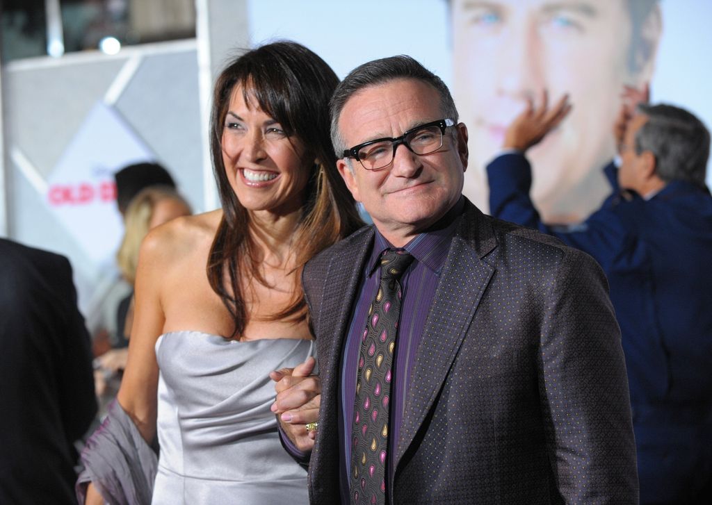 Actor Robin Williams (R) and Susan Schneider arrive at the premiere of Walt Disney Pictures' "Old Dogs" at the El Capitan Theatre on November 9, 2009 in Hollywood, California.