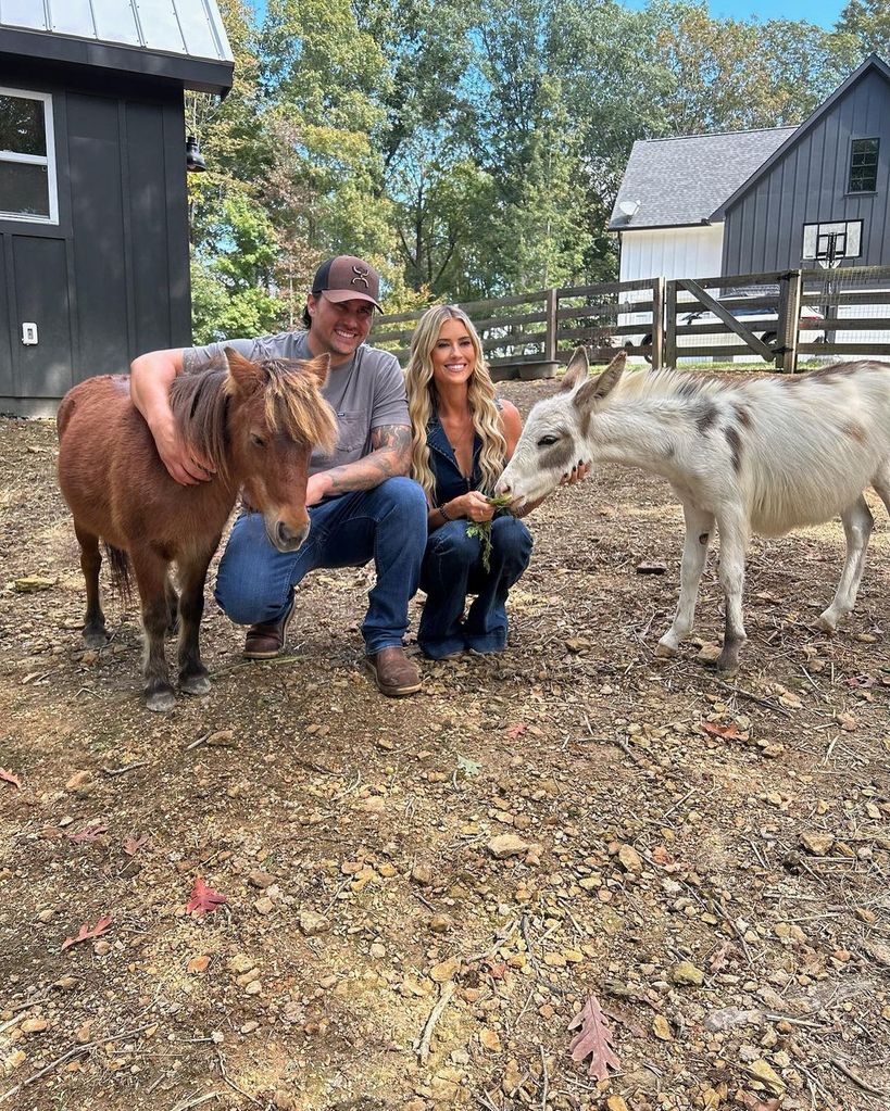 Christina Hall and husband Joshua Hall with the newest additions to the family farm