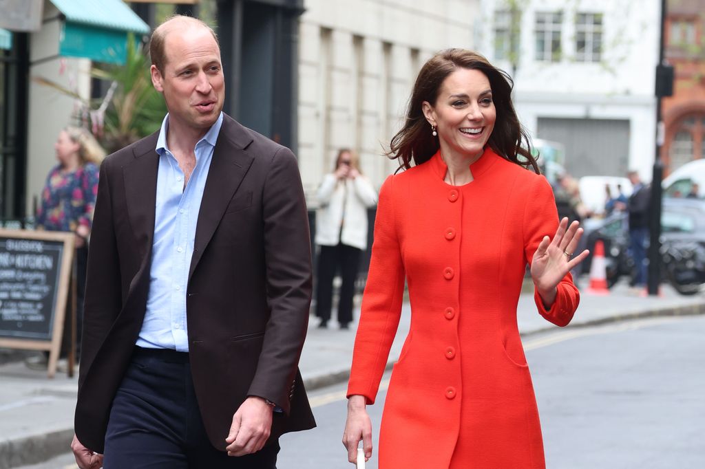 Prince William and Kate Middleton walking through Soho