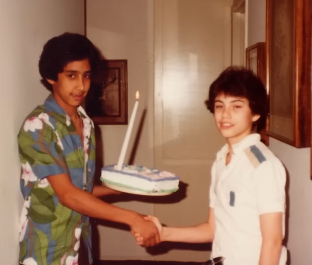 Jimmy and Cleto shaking hands as kids