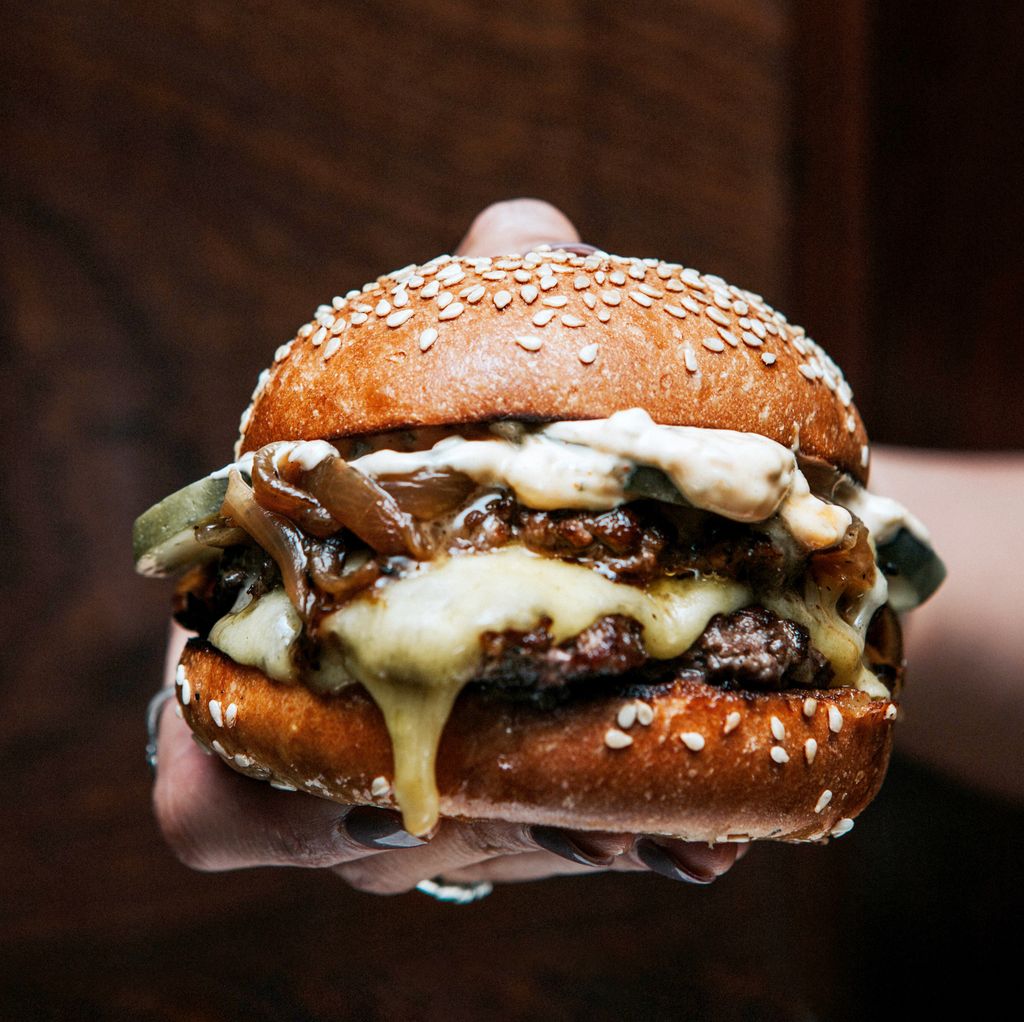 A burger from Blacklock with double patties, melting cheese and pickles