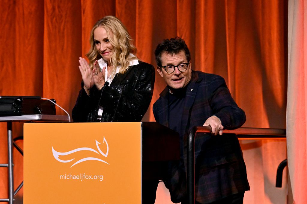 Tracy Pollan and Michael J. Fox speak onstage at 2023 A Funny Thing Happened On The Way To Cure Parkinson's at Casa Cipriani on November 11, 2023 in New York City.