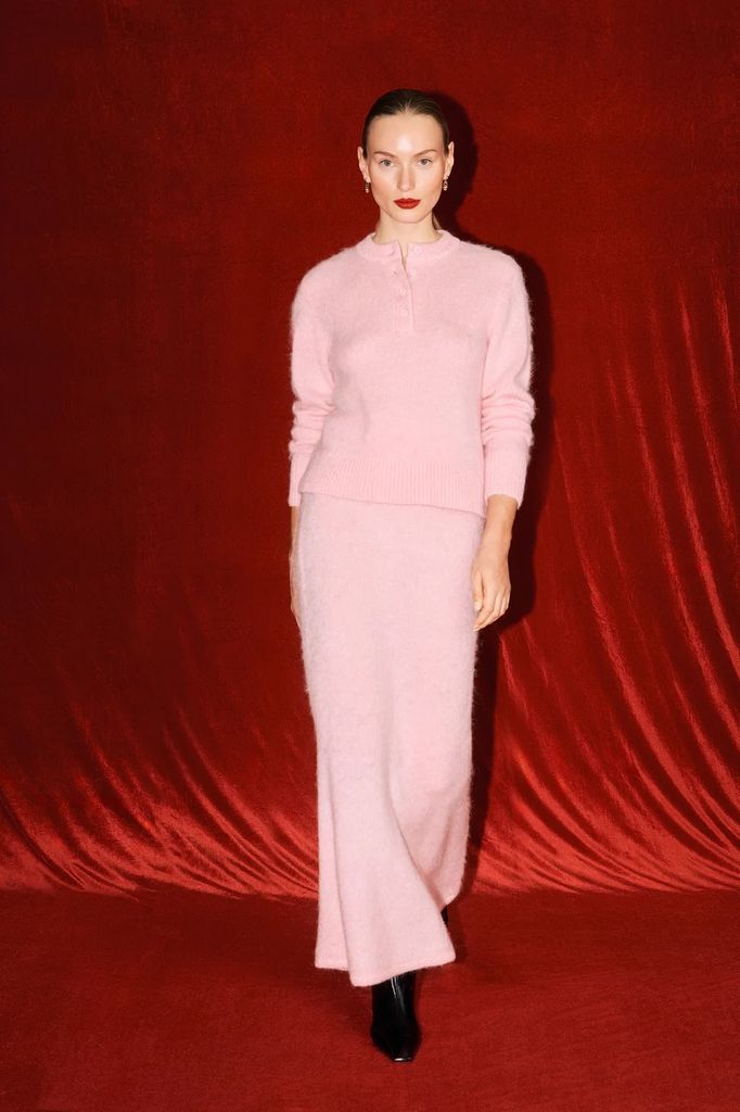 model in pink knitted jumper and skirt co-ord