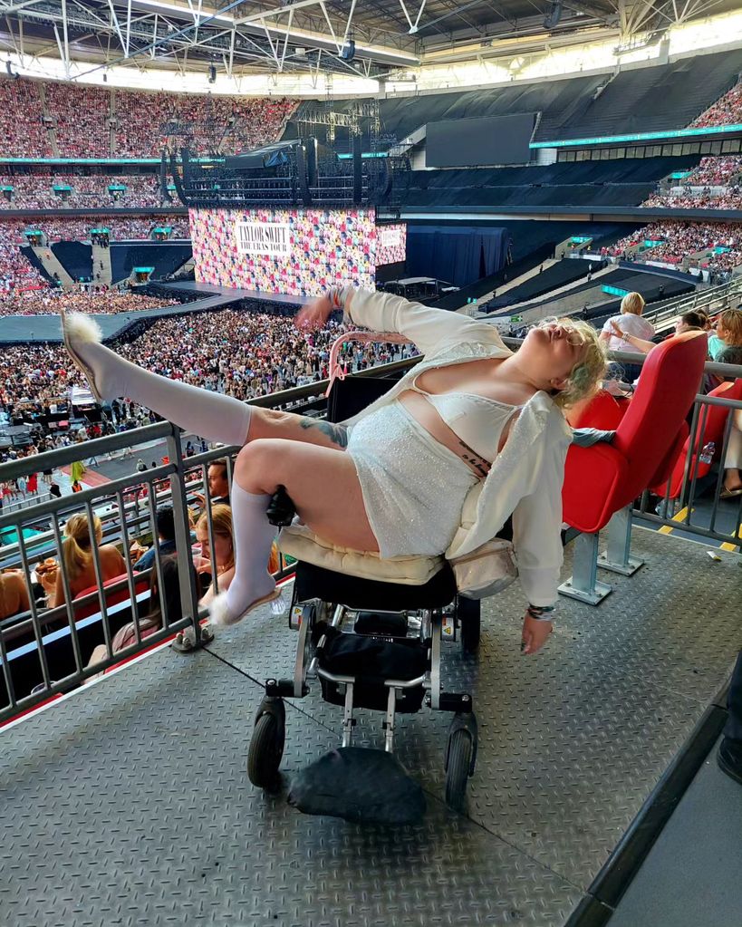 woman reclining in a wheelchair at the eras tour 