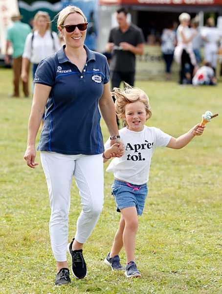 Zara and Mia walk hand in hand at Whatley Manor Gatcombe International Horse Trials in 2019