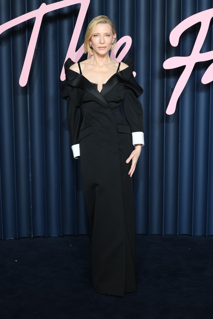 Cate Blanchett posed in black tuxedo dress