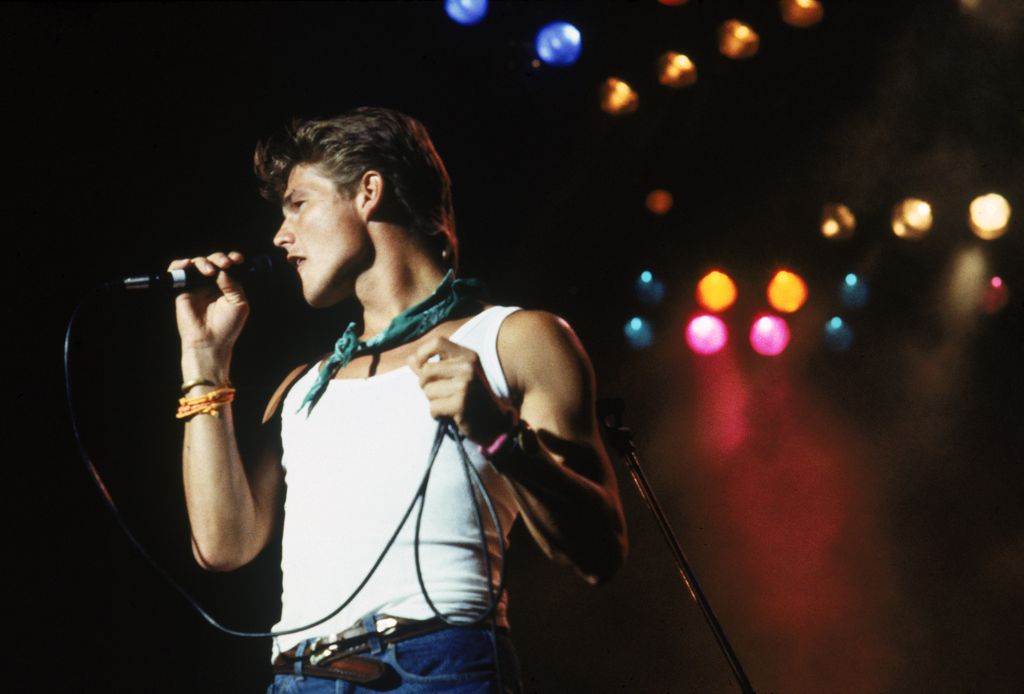 A young Morton Harket performing
