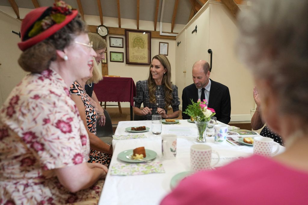 Britain's Catherine, Princess of Wales and Britain's Prince William, Prince of Wales visit the National Federation of Women's Institute (WI) in Sunningdale, west of London on September 8, 2025, to commemorate the three-year anniversary of the death of William's late grandmother Queen Elizabeth II. The Prince will meet with members from Sunningdale WI there and across Berkshire to hear about the work of the WI and how it gives opportunities for women to socialise, learn new skills and engage in community projects. (Photo by Alastair Grant / POOL / AFP) (Photo by ALASTAIR GRANT/POOL/AFP via Getty Images)          