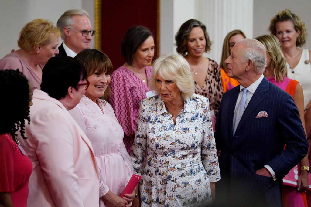 King Charles and Queen Camilla with Lorraine Kelly and a group of women