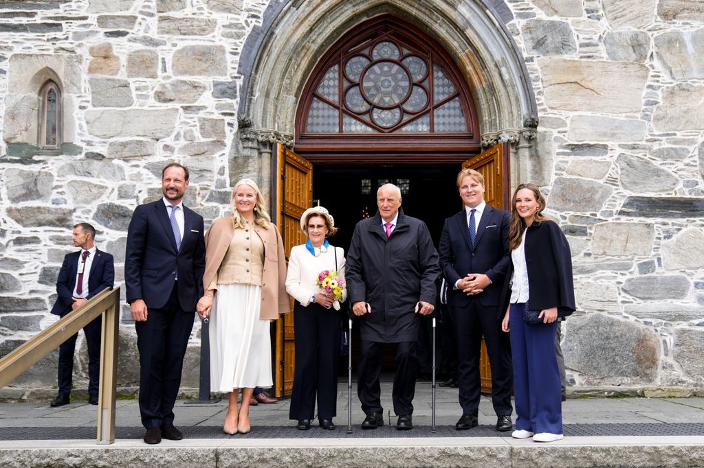 Members of the Norwegian royal family standing outside a church