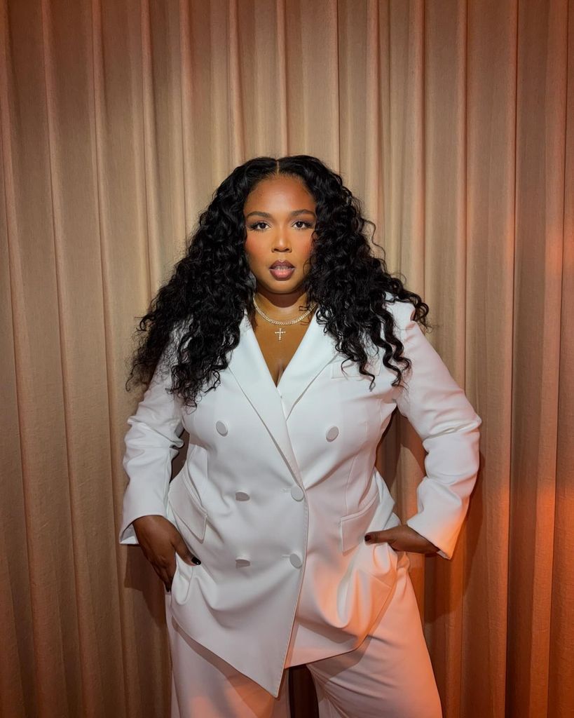 lizzo wearing white suit