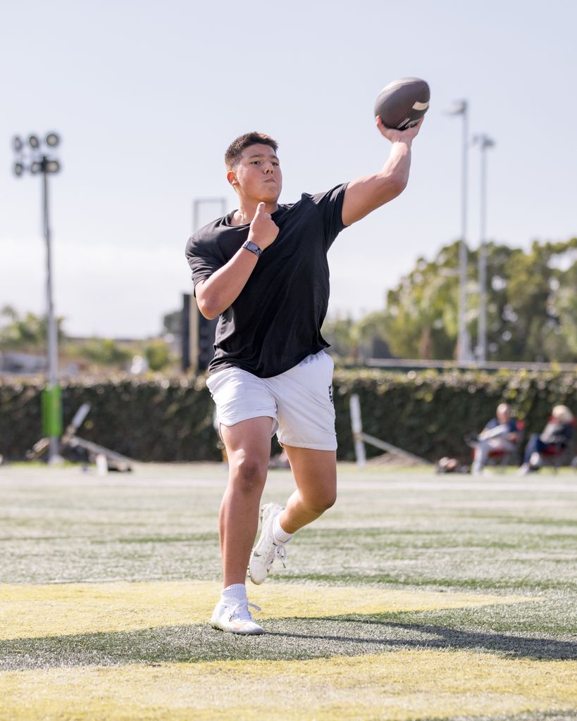Quarterback Dayton Raiola going through drills 
