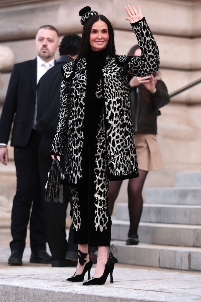 Demi Moore waves at fans at the the Schiaparelli Haute Couture Week Spring/Summer 2026 show