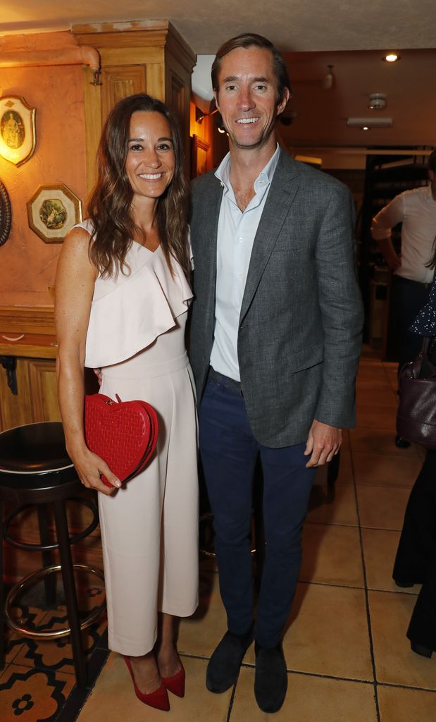 Pippa wearing a stunning jumpsuit at a party with her husband James in 2017