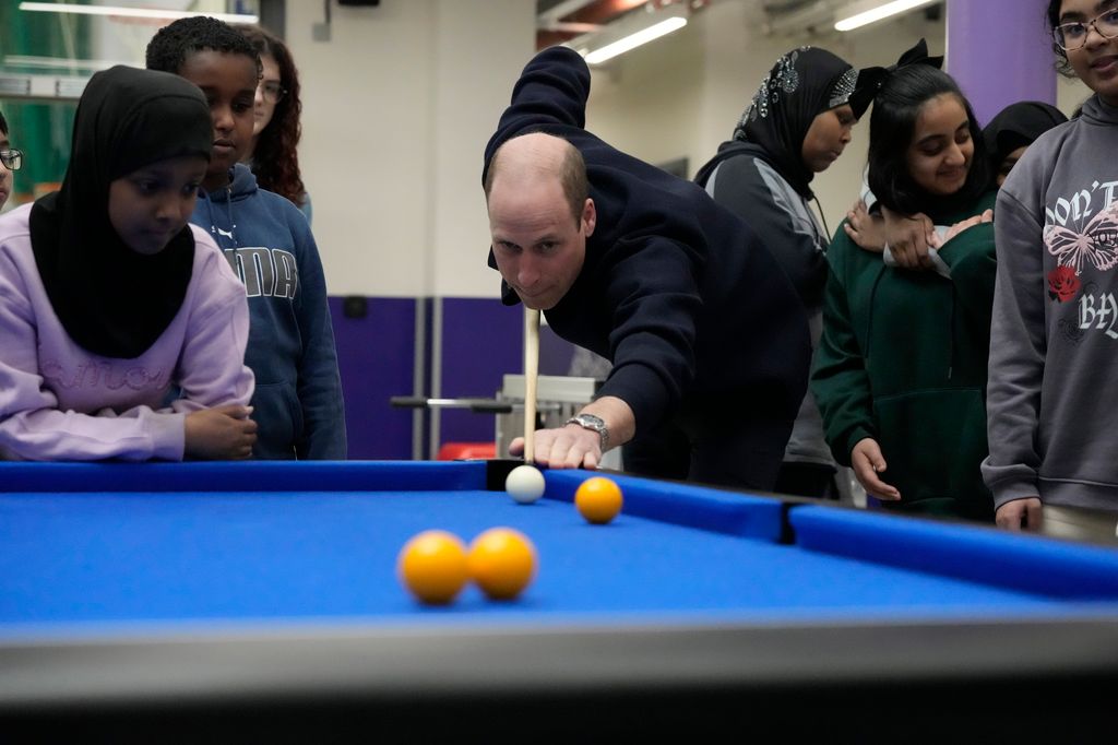 Prince William playing a game of pool at WEST, a new OnSide Youth Zone