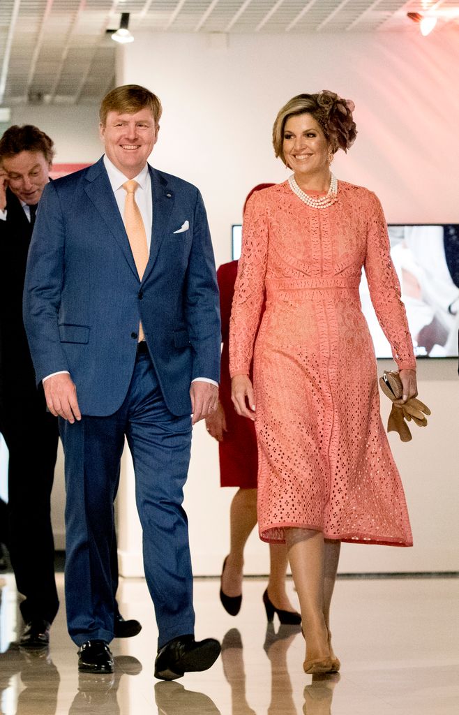 Queen Maxima in coral dress with King Willem-Alexander